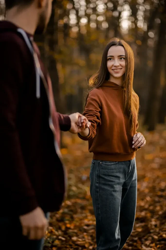 close up smiley woman holding man s hands 23 2148755763 1