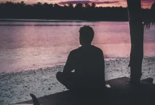 silhouette lonely person sitting by sea enjoying beautiful view sunset 181624 43362